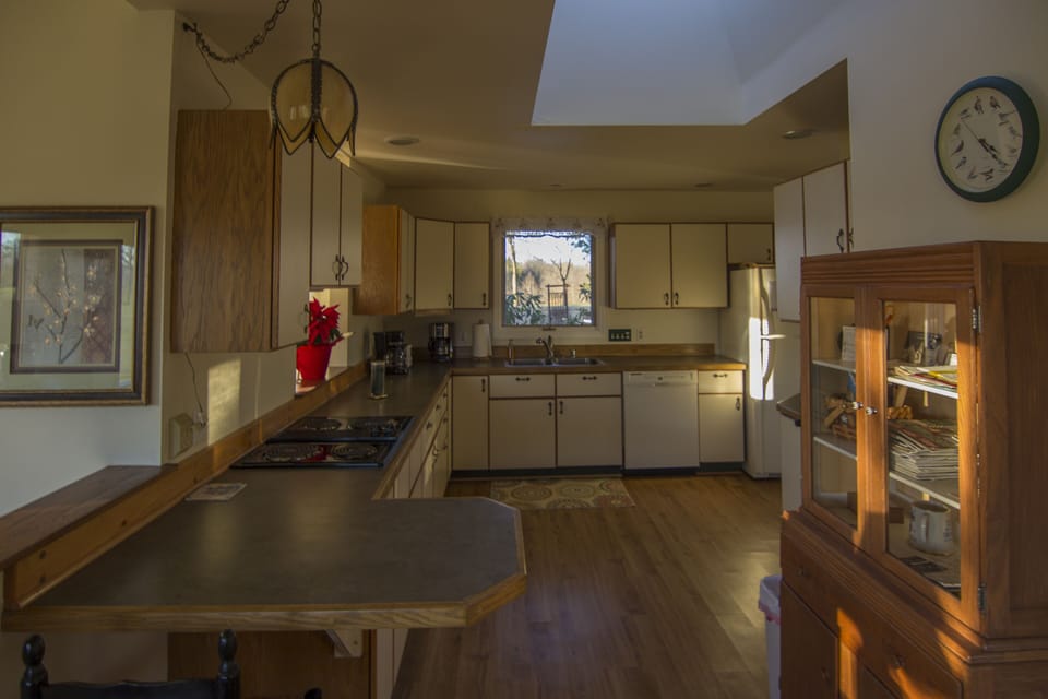 Large, well-equipped kitchen will delight any chef; window onto beautiful garden