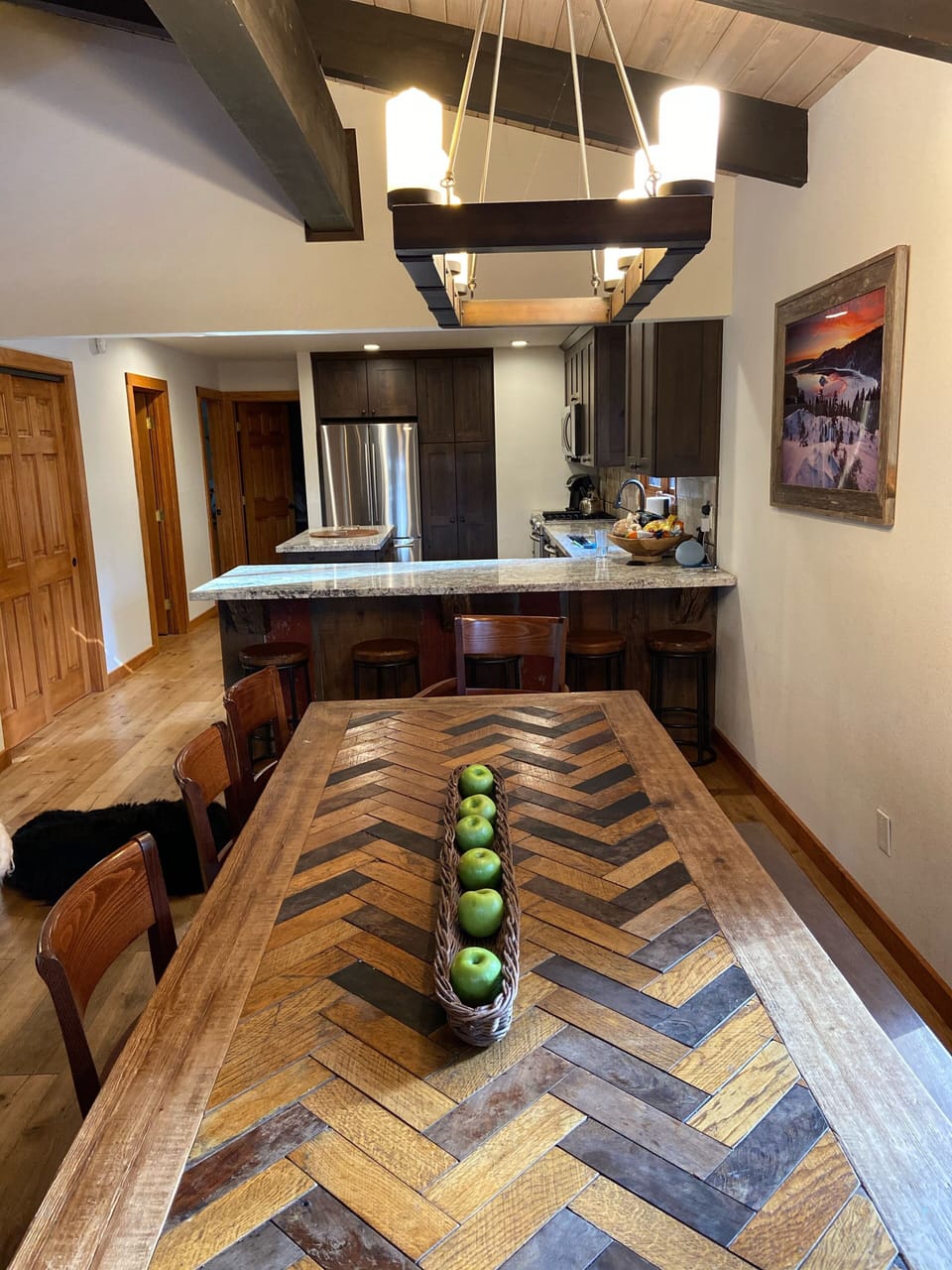 Large dinning table seats 10-12.   5 Counter bar stools.