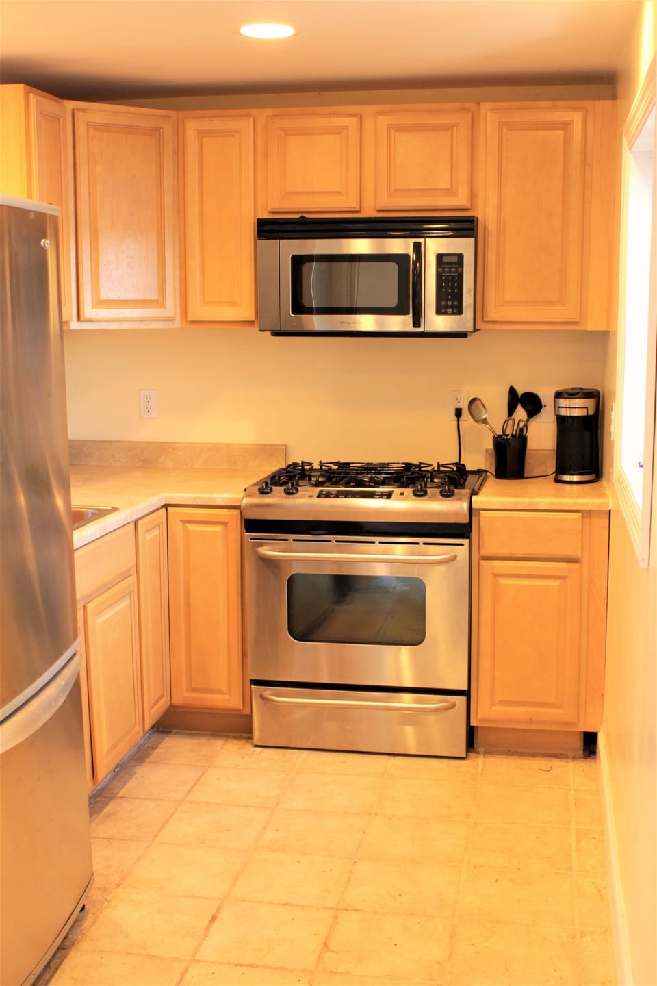 Kitchen - Stainless 6 burner gas stove, microwave, fridge