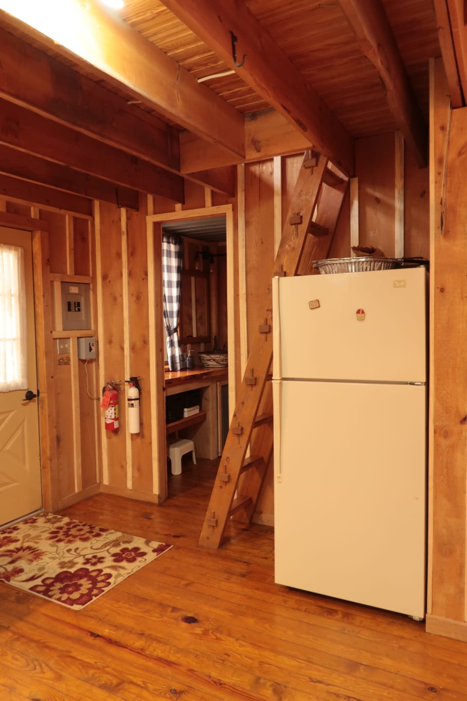 entry door, bathroom door, ladder to loft and fridge.