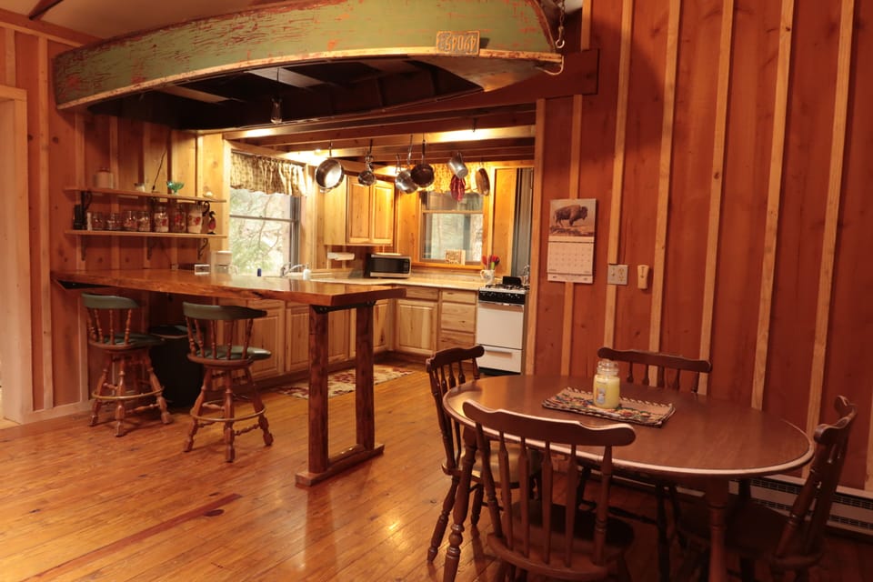 Looking at kitchen with dining table in the right side.