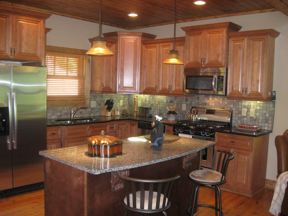 Designer kitchen with custom cabinetry, granite and slate