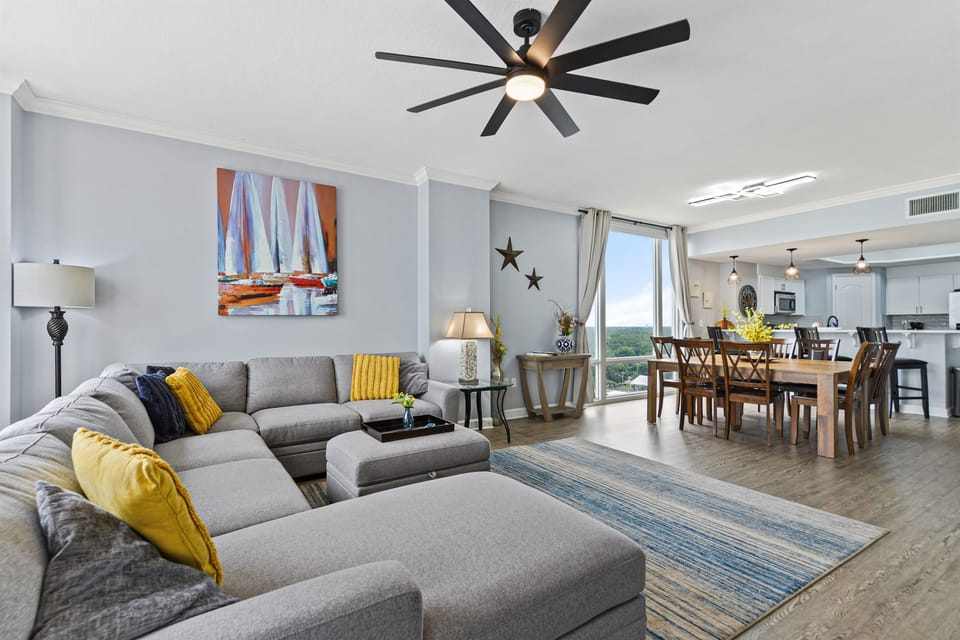 Living room; 60" 4k Roku TV, oversized sectional sofa. Looking at over sized dining table, easily seats 8 or more. 