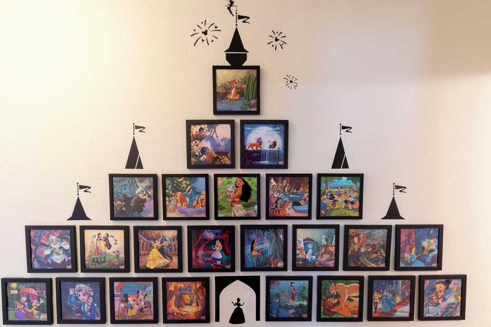 Disney themed gallery wall adds a magical touch for Disney fans.
