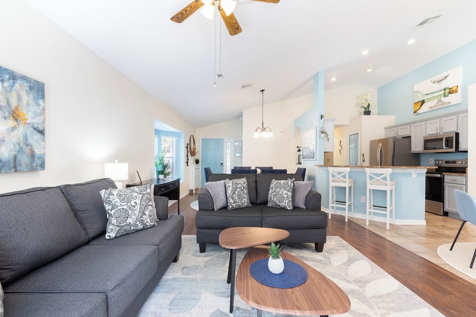 Bright open concept living space with seamless flow from kitchen to lounge
