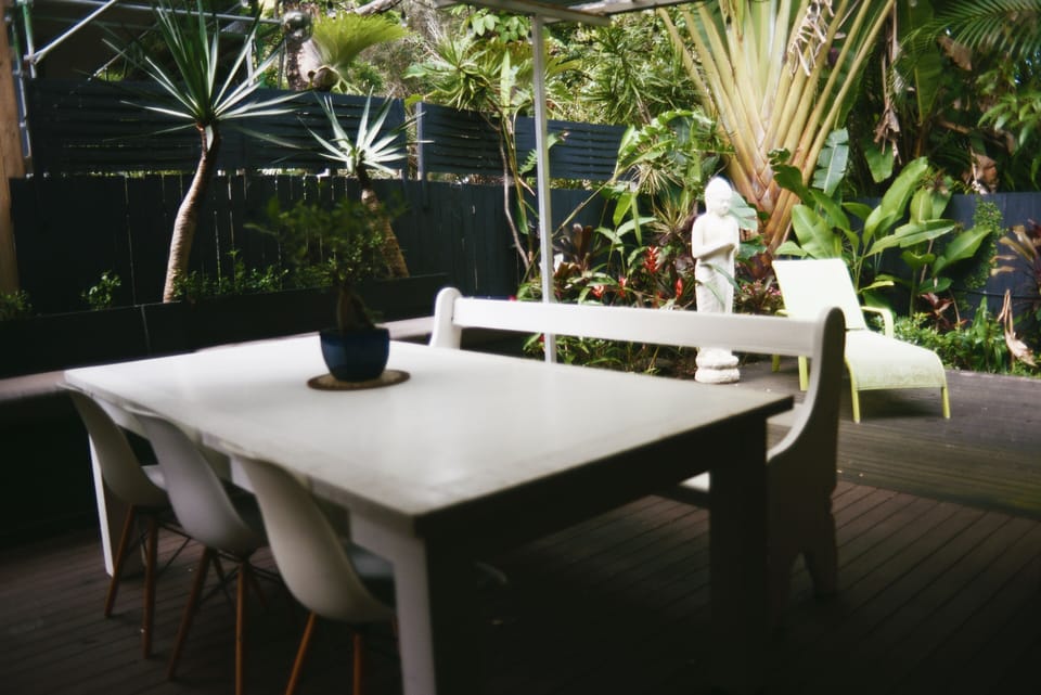 Outdoor entertaining amidst a peaceful & lush garden with wrap around deck