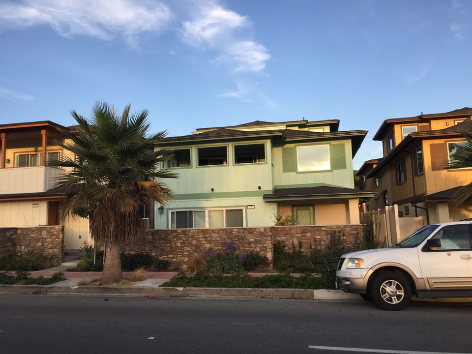 front of home faces ocean