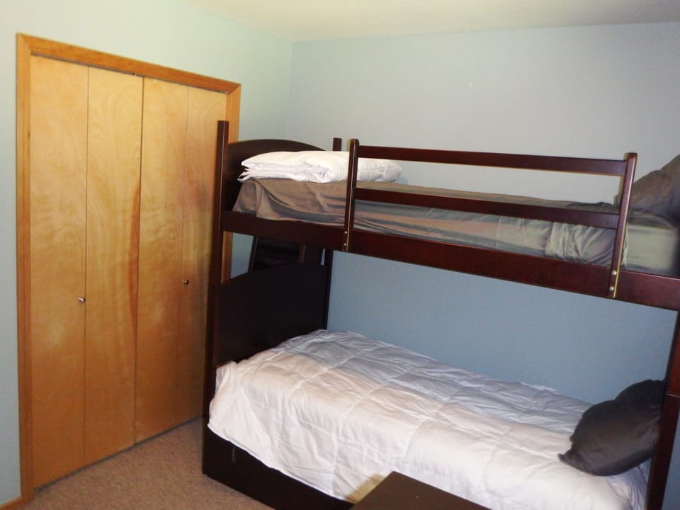 Downstairs guest bedroom with bunk and trundle beds