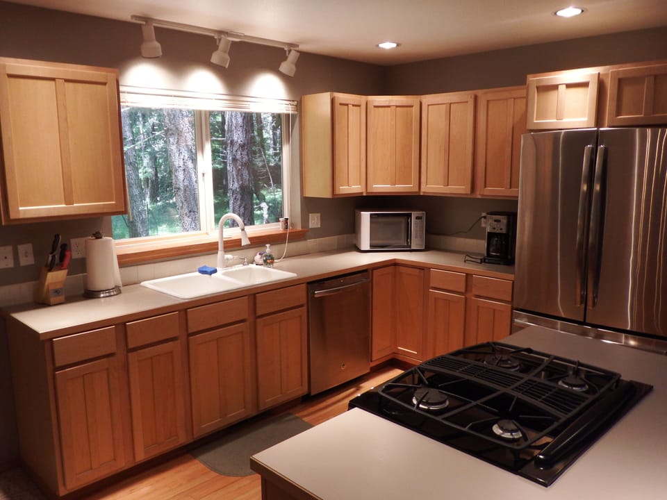 Kitchen with new stainless steel appliances and gas cooktop