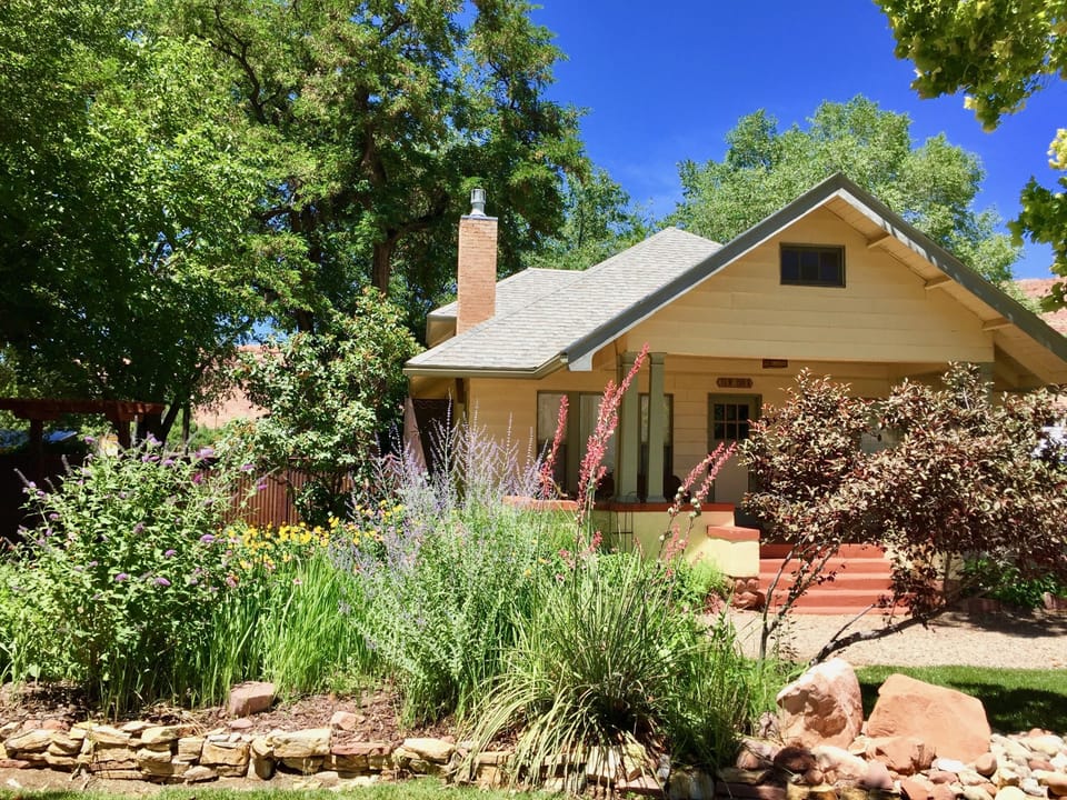 A beautiful cottage surrounded by gardens and views