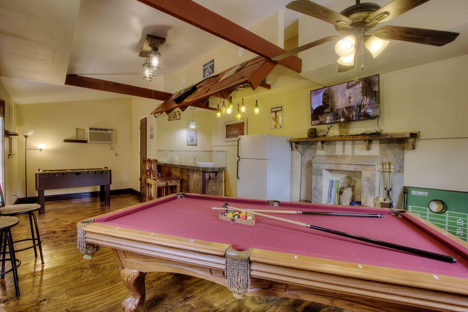 Game room with foosball, full bar ,pool table and full bath 
