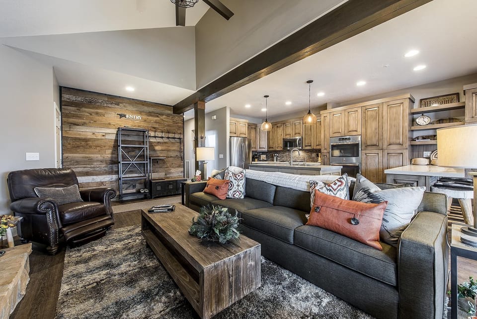  Family Room - 3 cowhide stools have been added to room in front of fireplace.