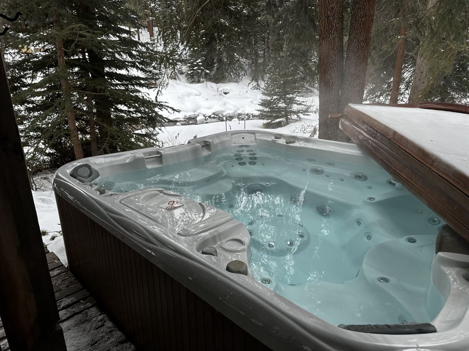 Hot tub off the lower deck, overlooking the creek!