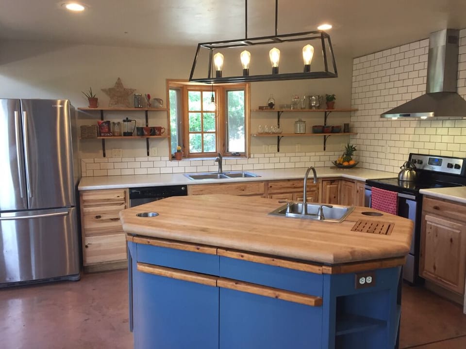 Full and spacious kitchen stocked with essentials and cooking utensils