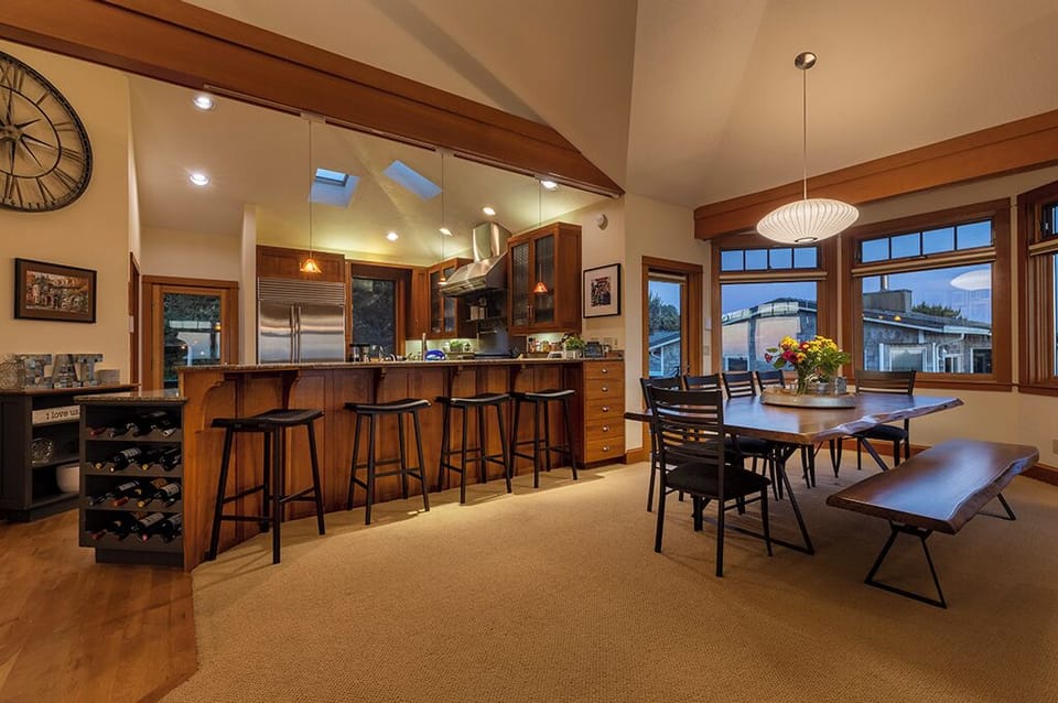 Open concept floor plan, kitchen opens up to dining area
