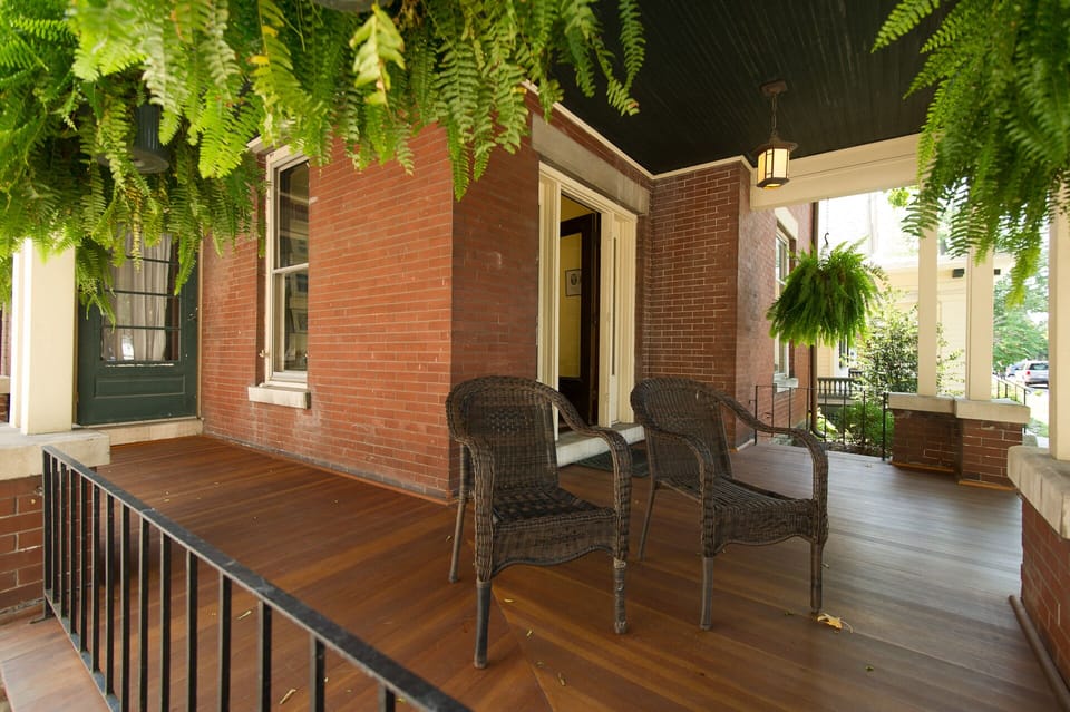 The wrap around front porch is a great place to be part of downtown happenings. 