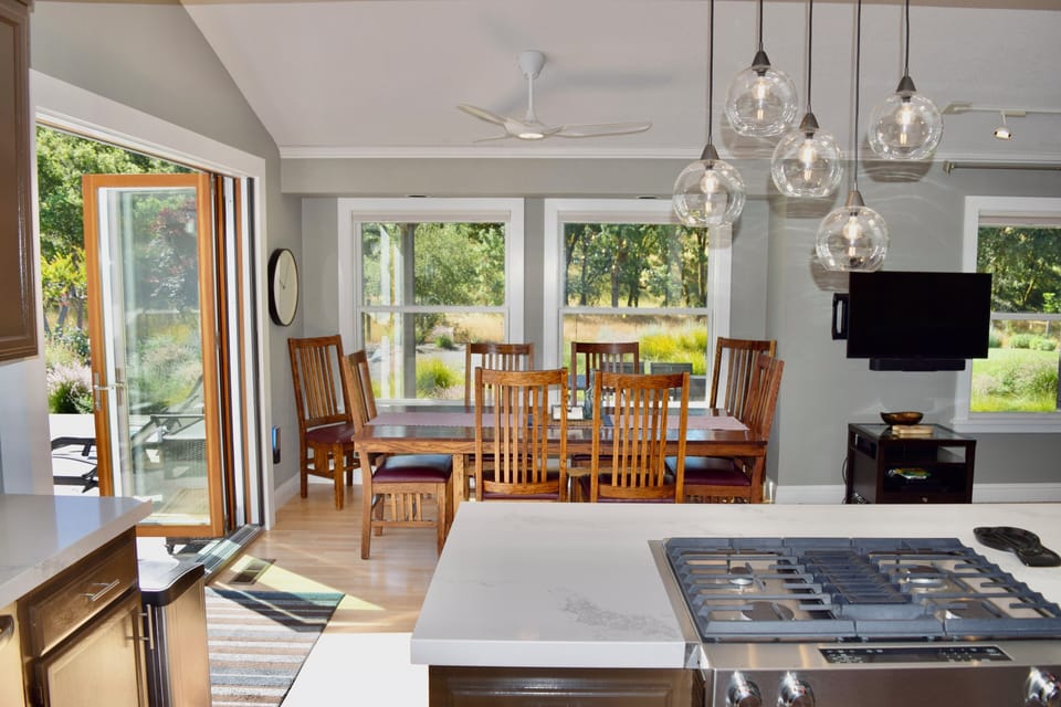 View from kitchen to dining area.  Pool is to left through folding patio door.