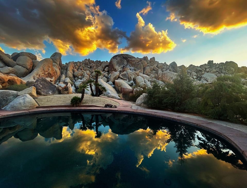 Dark bottom pool reflects the clouds during the late summer monsoon season.