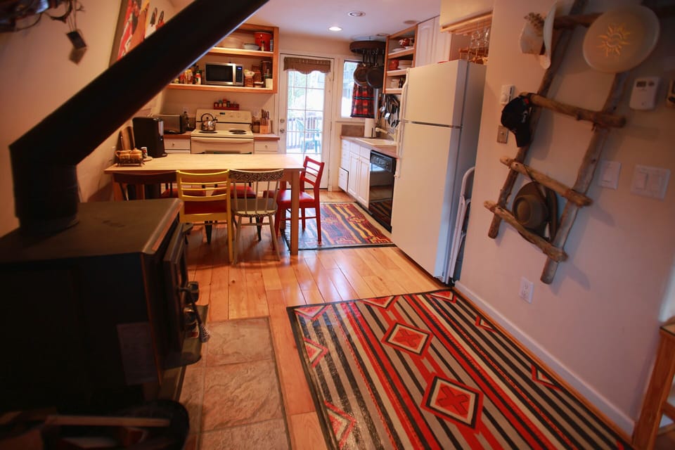fully equipped kitchen and dining area - wood Fireplace