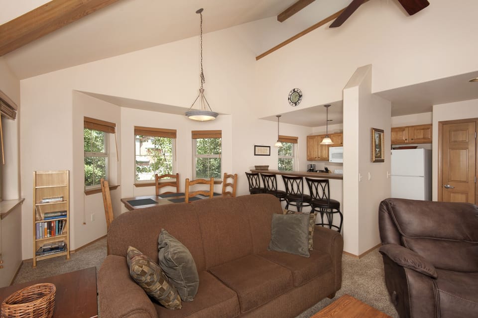 Main level living area with smart TV and gas fireplace.