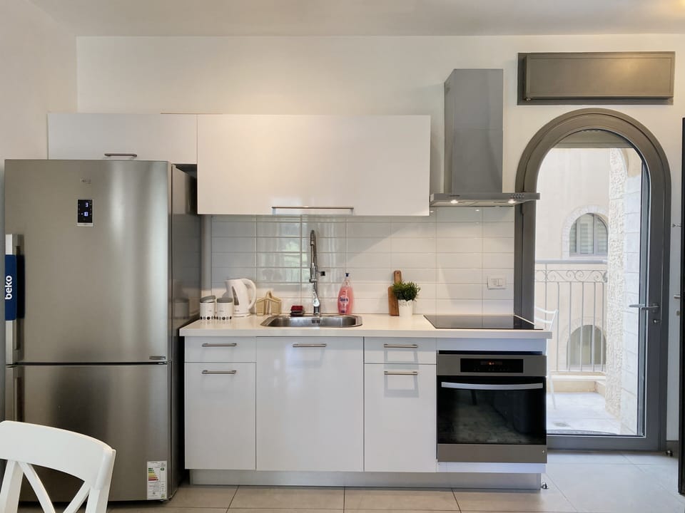 You may use my fully stocked kitchen but please keep it tidy! 