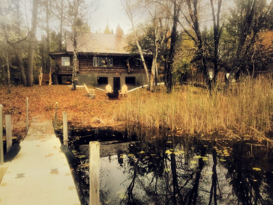 Dock view of the lodge with the garage to the right. 