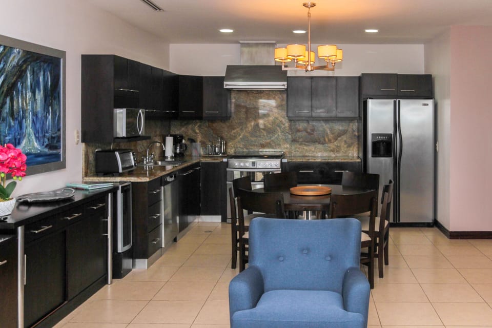 View of the kitchen and inside dining table from living area
