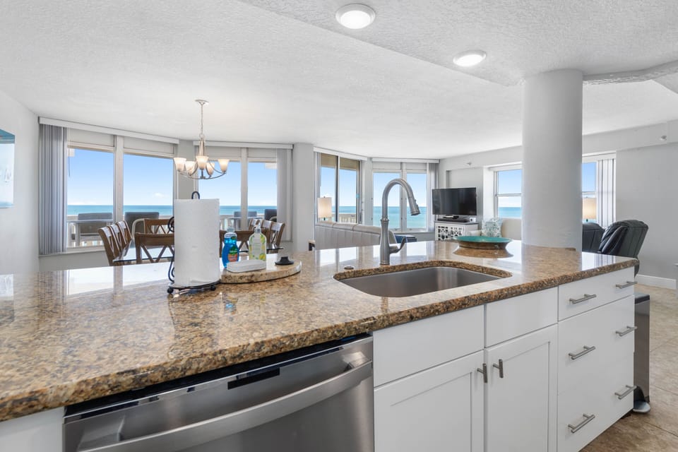 Kitchen overlooking into dining room and living room