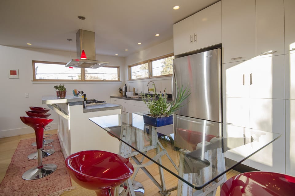 At the top of the stairs - open dining, kitchen, bar top.  Lots of light!