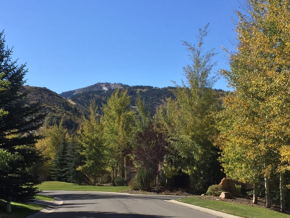 Deer Lake Village main road in the fall, top of Deer Valley resort in distance.
