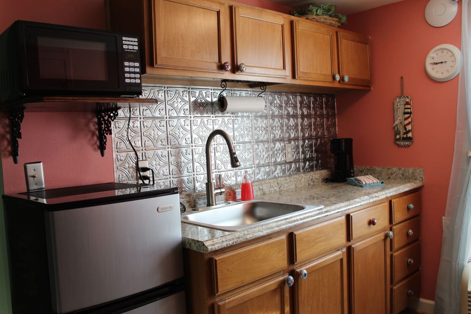 New backsplash, counter top, sink, faucet and ceramic handle hardware.