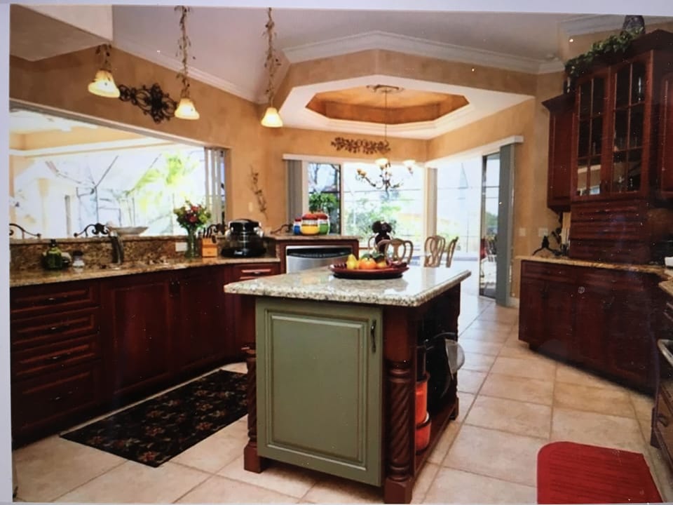 Kitchen island with illuminated tray ceilings