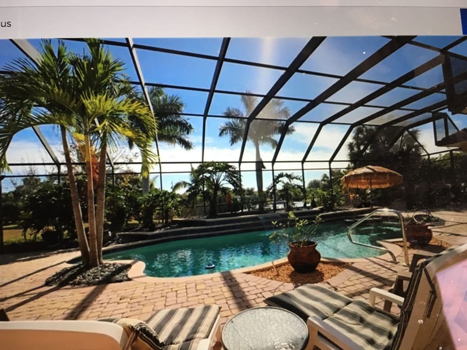 over sized pool with waterfall feature