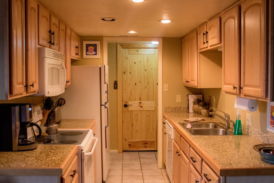 Fully appointed Kitchen with new stove. Microwave, coffee maker, dishwasher.