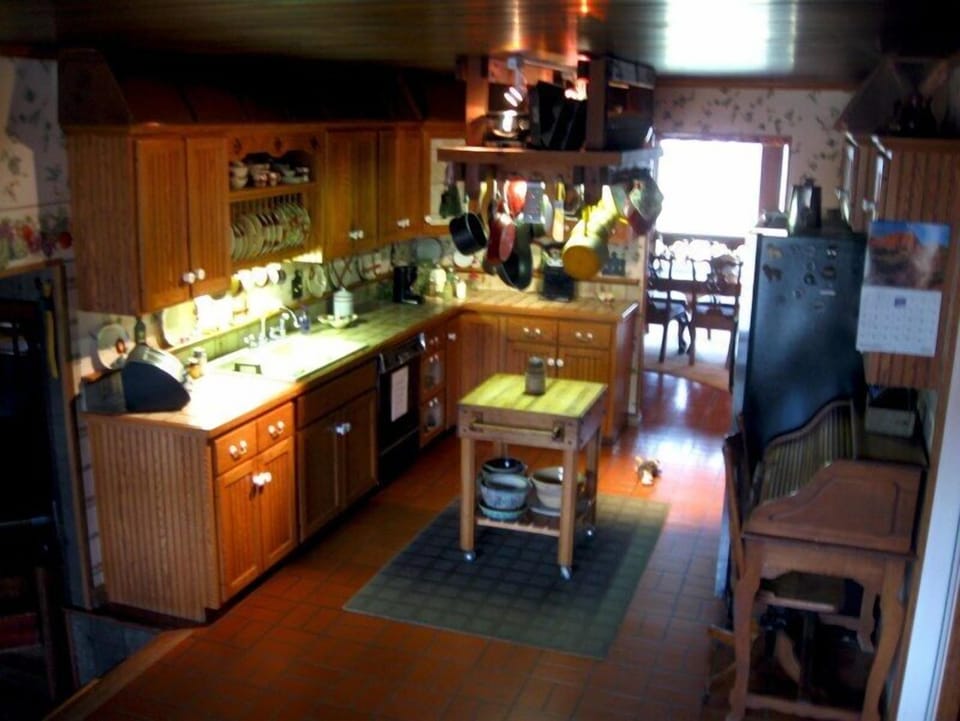 A large, full service kitchen has everything necessary to make gourmet meals.