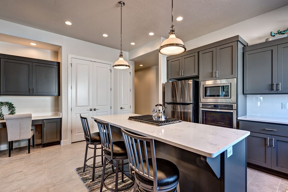 Side View of Kitchen - Side view of kitchen showing off the beautiful counter tops and stainless-steel appliances.