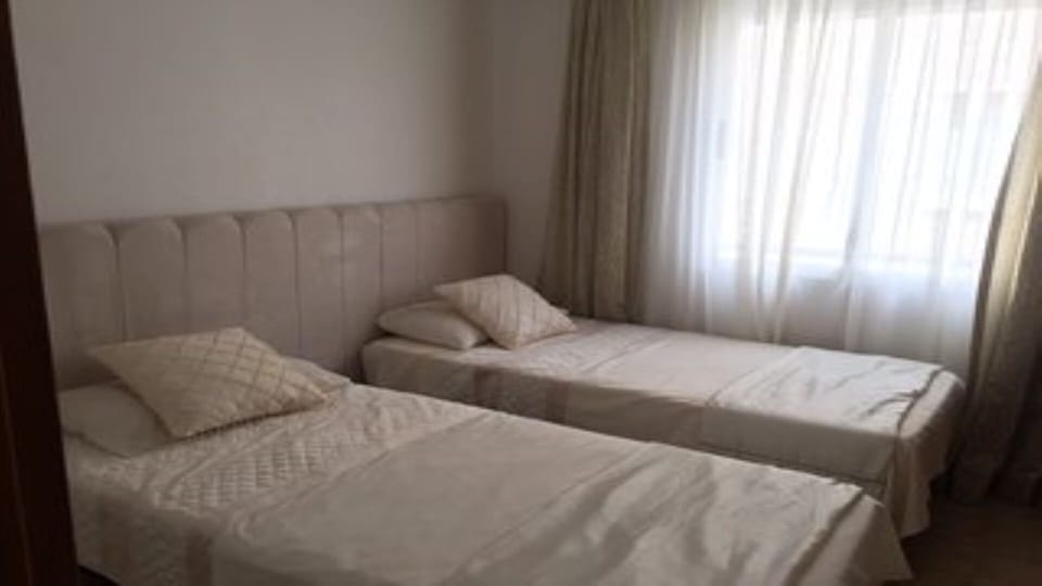 bedroom 3 with aircon and fully fitted wardrobe with safe & hangers.