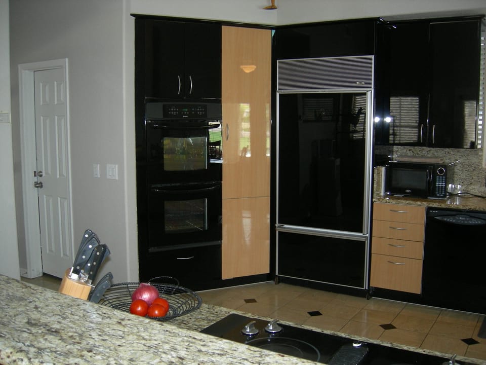 Double oven, sub zero refrigerator,  Italian cabinets and granite counter-tops