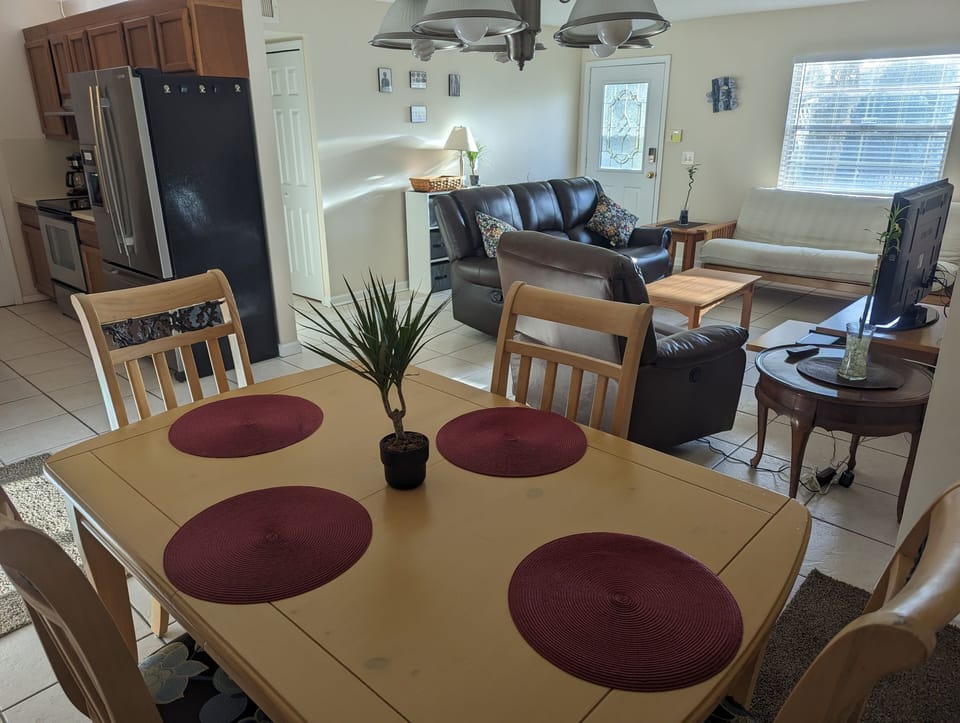 view from dining, into kitchen/living/entry