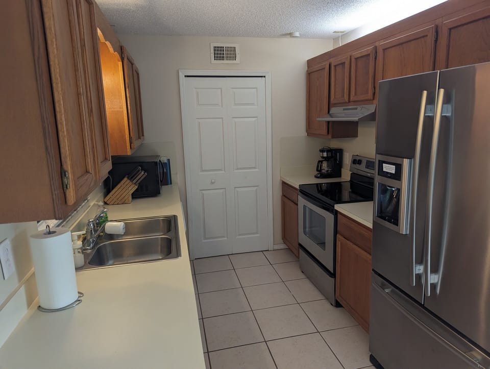 galley kitchen with large pantry 