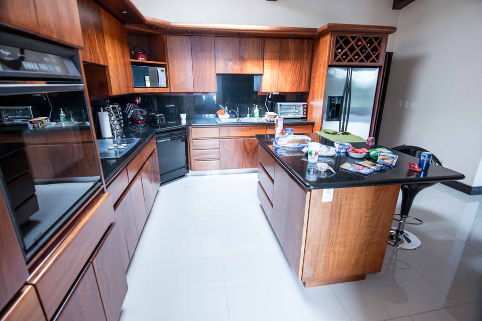 Kitchen area with granite and custom Cristobal Cabinets.  