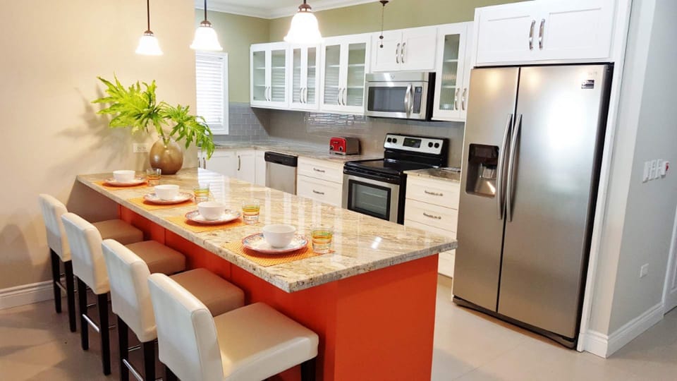 Kitchen with snack bar and bar stools