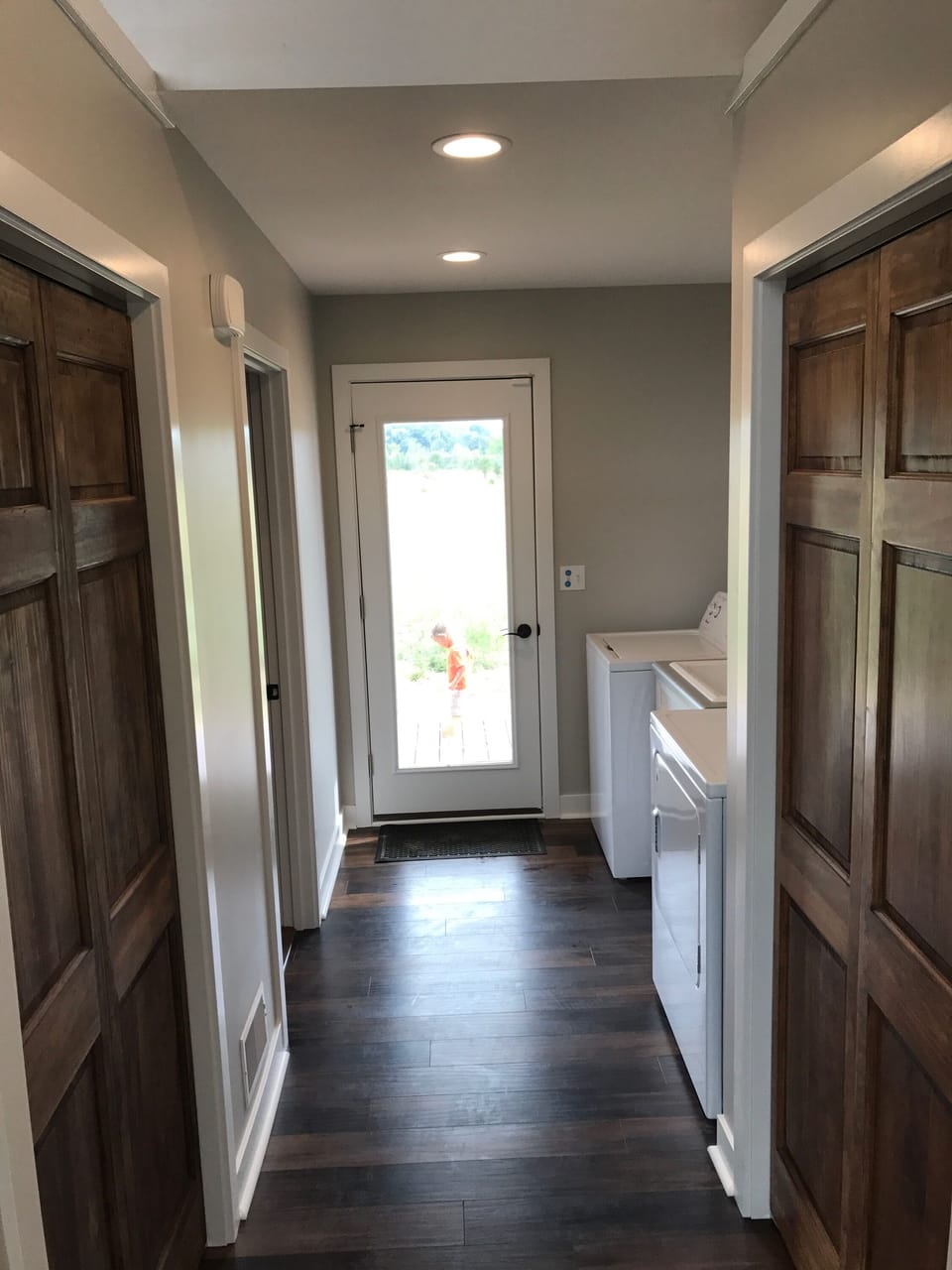 Hallway with washer and dryer.  