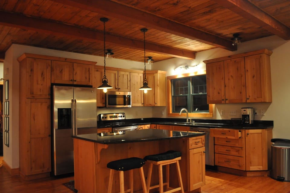 Modern country kitchen with stainless appliances. 