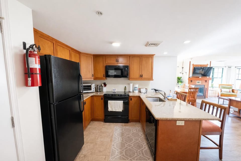 Spacious kitchen with modern appliances and breakfast bar