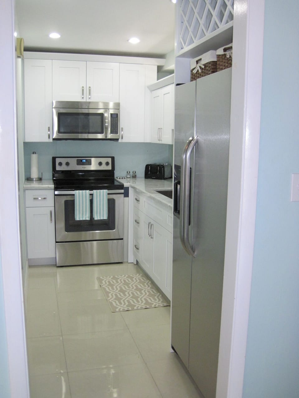 Newly renovated kitchen with stainless steel appliances & Carrera marble counter