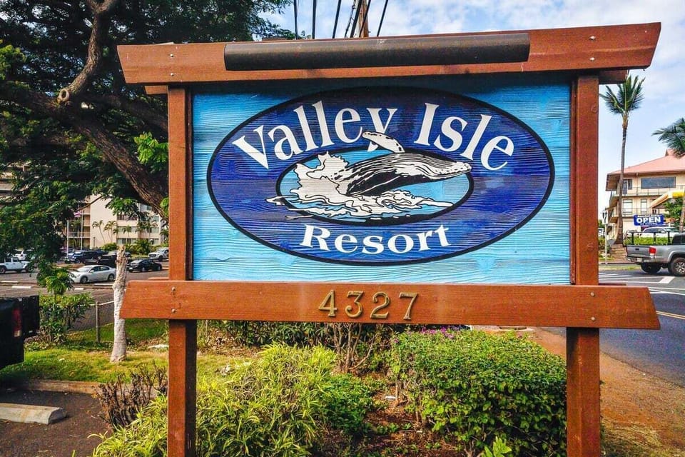 The Valley Isle Resort sign, welcoming you to your island getaway with tropical flair.
