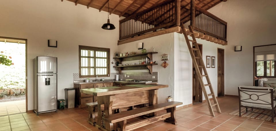 Kitchen with gorgeous slab dining table.