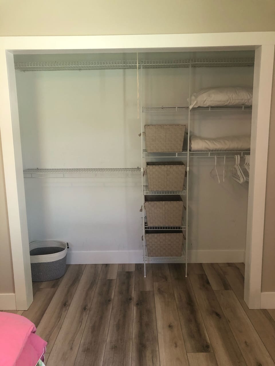 The Spring Room closet - plenty of storage space with baskets and hangars
