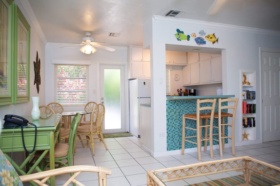 Kitchen opens to gathering room makes  a happy chef and bartender